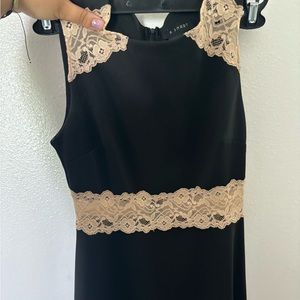 woman’s black mini dress